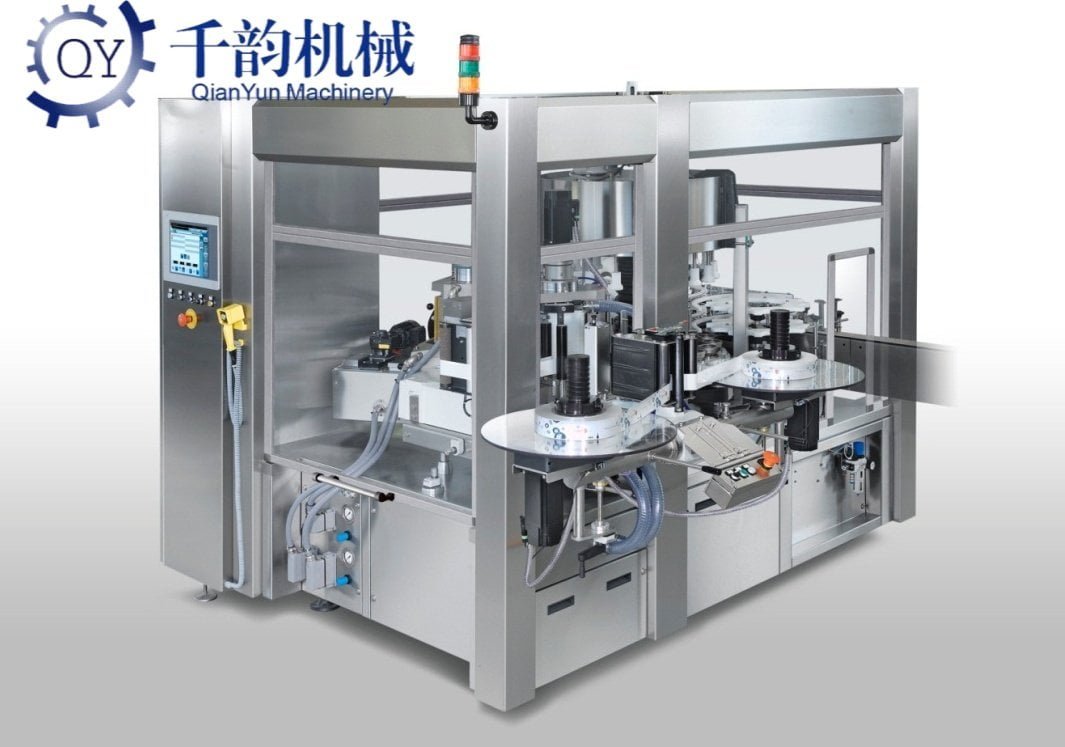Hot-melt glue labeling machine detail - precision label application system for round bottles and containers in liquid packaging lines